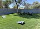 Large backyard with lawn, block wall, and seating area for outdoor entertaining at 419 W 11Th St, Tempe, AZ 85281