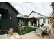 Outdoor patio with dining table, chairs, umbrella, and charming seating area with artificial turf for entertaining at 419 W 11Th St, Tempe, AZ 85281