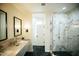 Bathroom featuring a dual marble vanity and a glass enclosed marble shower at 419 W 11Th St, Tempe, AZ 85281