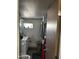Bathroom with a single sink vanity and hanging towel rack at 4211 W Roosevelt St # 235, Phoenix, AZ 85009