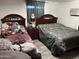 Bright bedroom showcasing two beds and matching bedside table at 4211 W Roosevelt St # 235, Phoenix, AZ 85009