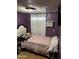 Bedroom with modern decor, light colored bedding, and accent pillows at 4211 W Roosevelt St # 235, Phoenix, AZ 85009