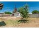 Large backyard featuring a storage shed, block fence and mature tree at 4531 N 12Th Dr, Phoenix, AZ 85013