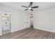 Large bedroom with wood-look floors, leading to an ensuite bathroom and closet at 4531 N 12Th Dr, Phoenix, AZ 85013