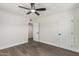 A bright bedroom features wood-look flooring, white walls, and a ceiling fan at 4531 N 12Th Dr, Phoenix, AZ 85013