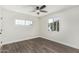 Inviting bedroom with wood-look floors, a ceiling fan, and abundant natural light at 4531 N 12Th Dr, Phoenix, AZ 85013