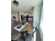 Cozy dining area near a kitchen with stainless steel appliances and sleek white cabinets at 4531 N 12Th Dr, Phoenix, AZ 85013