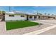 Attractive single-Gathering home with a green lawn, solar panels, and a welcoming walkway at 4531 N 12Th Dr, Phoenix, AZ 85013