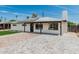 Lovely home featuring a pristine lawn, solar panels, a paved walkway, and updated exterior at 4531 N 12Th Dr, Phoenix, AZ 85013