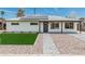 Charming home featuring a neatly manicured lawn and stylish walkway leading to the front door at 4531 N 12Th Dr, Phoenix, AZ 85013