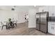 Modern kitchen with stainless steel refrigerator and dining area, perfect for entertaining at 4531 N 12Th Dr, Phoenix, AZ 85013