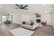 Cozy living area with hardwood floors, a fireplace, a comfortable couch, and a view to kitchen at 4531 N 12Th Dr, Phoenix, AZ 85013