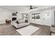 Bright living room with a cozy fireplace, hardwood floors, and large windows offering great views at 4531 N 12Th Dr, Phoenix, AZ 85013