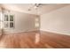 Spacious bedroom with hardwood floors and plantation shutters at 492 E Vermont Dr, Gilbert, AZ 85295