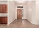 Entryway with a decorative door and tile flooring; custom cabinets to the left at 492 E Vermont Dr, Gilbert, AZ 85295