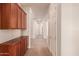 Bright hallway with built-in cabinets and tile flooring at 492 E Vermont Dr, Gilbert, AZ 85295