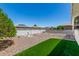 Large gravel backyard with minimalist desert landscaping and a tidy perimeter wall at 5122 E Emerald Cir, Mesa, AZ 85206