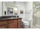 Bathroom featuring a granite vanity, mirrored cabinet, and a step-in shower at 5122 E Emerald Cir, Mesa, AZ 85206