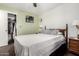 Cozy bedroom with closet space and a bright, inviting atmosphere with green accent wall at 5122 E Emerald Cir, Mesa, AZ 85206