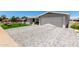 Well-maintained home featuring a brick-paved driveway and lush landscaping, offering great curb appeal at 5122 E Emerald Cir, Mesa, AZ 85206
