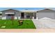 Charming home featuring an immaculate lawn, manicured landscaping, and brick-paved driveway at 5122 E Emerald Cir, Mesa, AZ 85206