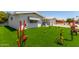 Well-maintained home featuring a brick-paved driveway and lush landscaping, offering great curb appeal at 5122 E Emerald Cir, Mesa, AZ 85206