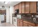 Well-organized kitchen with wooden cabinets, durable countertops and standard appliances at 5122 E Emerald Cir, Mesa, AZ 85206