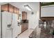 Functional kitchen featuring granite countertops, tile backsplash, and ample cabinet space at 5122 E Emerald Cir, Mesa, AZ 85206