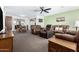Spacious living room with multiple seating options, seamlessly connected to the dining area at 5122 E Emerald Cir, Mesa, AZ 85206