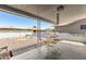 Covered patio provides shade for outdoor seating and a view of the landscaped yard at 5122 E Emerald Cir, Mesa, AZ 85206