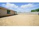 This backyard features dirt landscaping and a patch of artifical turf at 5956 N 188Th Ln, Litchfield Park, AZ 85340