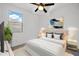 Beautifully staged bedroom featuring neutral tones and natural light from the window at 5956 N 188Th Ln, Litchfield Park, AZ 85340