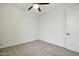 This bedroom features neutral carpet and white walls, with a ceiling fan at 5956 N 188Th Ln, Litchfield Park, AZ 85340