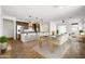 Open floor plan kitchen with stainless steel appliances, pendant lighting and a breakfast bar at 5956 N 188Th Ln, Litchfield Park, AZ 85340