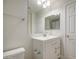 Updated bathroom featuring a white vanity, a toilet, and towel rack at 615 E Portland St # 261, Phoenix, AZ 85004