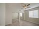 Bright bedroom featuring a ceiling fan, wood-look flooring, and window with white blinds at 615 E Portland St # 261, Phoenix, AZ 85004