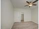 The bedroom has wood floors, a ceiling fan, a closet, and a door at 615 E Portland St # 261, Phoenix, AZ 85004
