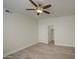 The bedroom has wood floors, a ceiling fan, a closet, and a door at 615 E Portland St # 261, Phoenix, AZ 85004