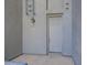 The front door is a modern gray with unit number 261, lit by a coach lamp at 615 E Portland St # 261, Phoenix, AZ 85004