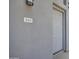 Close up of modern gray front door with unit number 261 above the door at 615 E Portland St # 261, Phoenix, AZ 85004