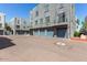 Row of garages in a condo complex, featuring blue doors and a well-maintained parking area at 615 E Portland St # 261, Phoenix, AZ 85004