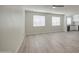 Living room with wood floors, ceiling fan and view of kitchen at 615 E Portland St # 261, Phoenix, AZ 85004