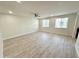Bright living room with a ceiling fan and two windows at 615 E Portland St # 261, Phoenix, AZ 85004