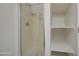 A clean walk-in shower with a built-in storage shelf at 615 E Portland St # 261, Phoenix, AZ 85004