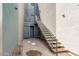 Exterior staircase leading to upper-level units, with metal railings and multiple entry doors below at 615 E Portland St # 261, Phoenix, AZ 85004