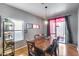 Cozy dining area with a wooden table, six chairs, and natural light at 6328 W Fawn Dr, Laveen, AZ 85339