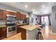 Well-equipped kitchen with granite countertops, stainless steel appliances, and an adjacent dining area at 6328 W Fawn Dr, Laveen, AZ 85339