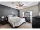 Comfortable main bedroom featuring a ceiling fan and dark wood furniture at 6328 W Fawn Dr, Laveen, AZ 85339