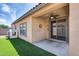 Covered patio featuring a ceiling fan and artificial turf at 6328 W Fawn Dr, Laveen, AZ 85339