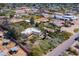 Wide aerial view of the property, showcasing the main house, guest house, pool and horse facilities at 6418 E Sunnyside Dr, Scottsdale, AZ 85254